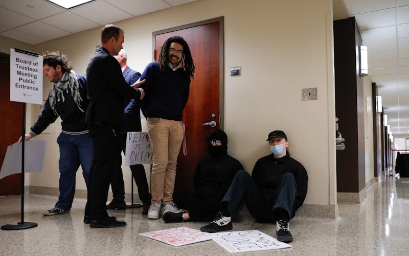 Ball State students are allegedly detained for disorderly conduct while protesting Brian Gallagher during a Board of Trustees meeting Feb. 28 at the L.A. Pittenger Student Center. Andrew Berger, DN