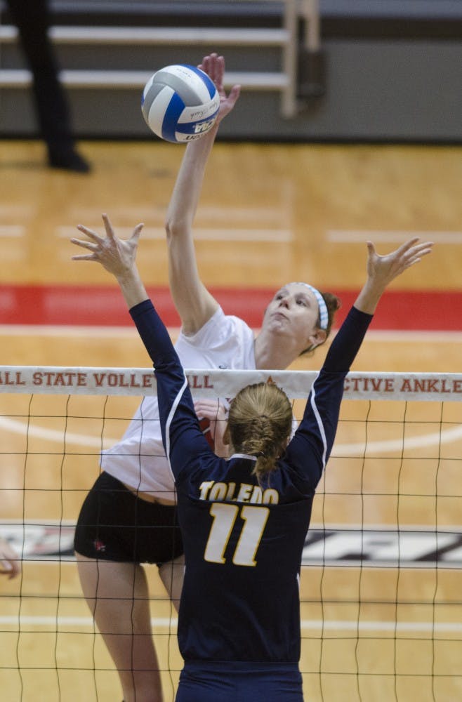 Redshirt sophomore middle blocker Hayley Benson hits the ball over the net against Toledo on Nov. 7 at Worthen Arena. DN PHOTO BREANNA DAUGHERTY 