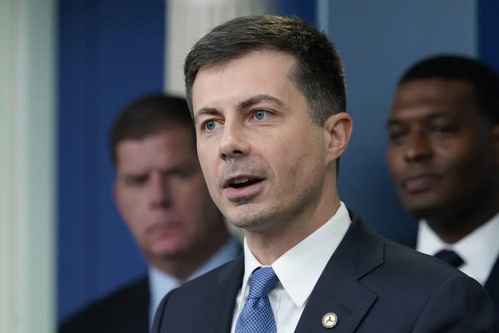 <p>FILE - Transportation Secretary Pete Buttigieg, center, speaks during a briefing at the White House in Washington, May 16, 2022, as Labor Secretary Marty Walsh, left, and Environmental Protection Agency administrator Michael Regan, right, listen. The Biden administration is saying the U.S. economy would face a severe economic shock if senators don&#x27;t pass legislation this week to avert a rail worker strike. Walsh and Buttigieg are meeting with Democratic senators Thursday, Dec. 1, to underscore that rail companies will begin shuttering operations well before a potential strike begins on Dec. 9. (AP Photo/Susan Walsh, File)</p>