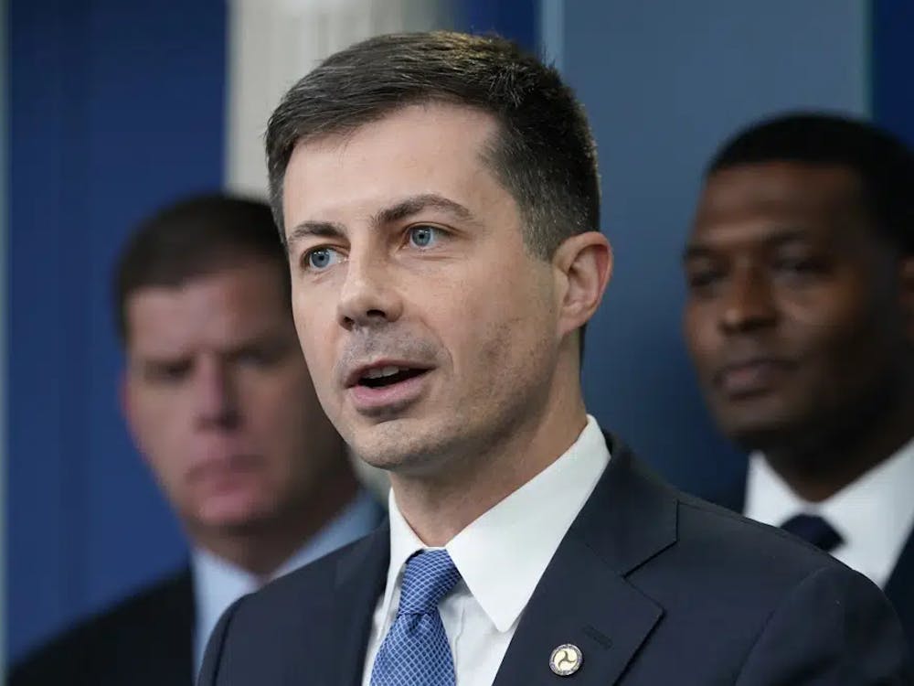 FILE - Transportation Secretary Pete Buttigieg, center, speaks during a briefing at the White House in Washington, May 16, 2022, as Labor Secretary Marty Walsh, left, and Environmental Protection Agency administrator Michael Regan, right, listen. The Biden administration is saying the U.S. economy would face a severe economic shock if senators don&#x27;t pass legislation this week to avert a rail worker strike. Walsh and Buttigieg are meeting with Democratic senators Thursday, Dec. 1, to underscore that rail companies will begin shuttering operations well before a potential strike begins on Dec. 9. (AP Photo/Susan Walsh, File)