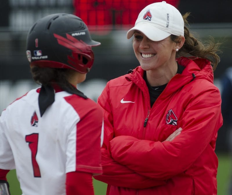 Head coach Megan Ciolli Bartlett talks with junior second baseman Maddy Labrador before her turn at bat during the second game of the double-header against Northern Illinois on April 4 at the Softball Field at the First Merchants Ballpark Complex. In the past six games, the Cardinals have gone 1-5 and enter the Mid-American Conference tournament playing against a Kent State team they haven't played since 2015.&nbsp;Emma Rogers // DN File