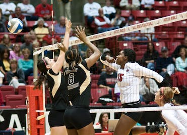 DN PHOTO JONATHAN MIKSANEK Senior middle hitter Lisa Scott's spike sails past the Western Michigan wall. 