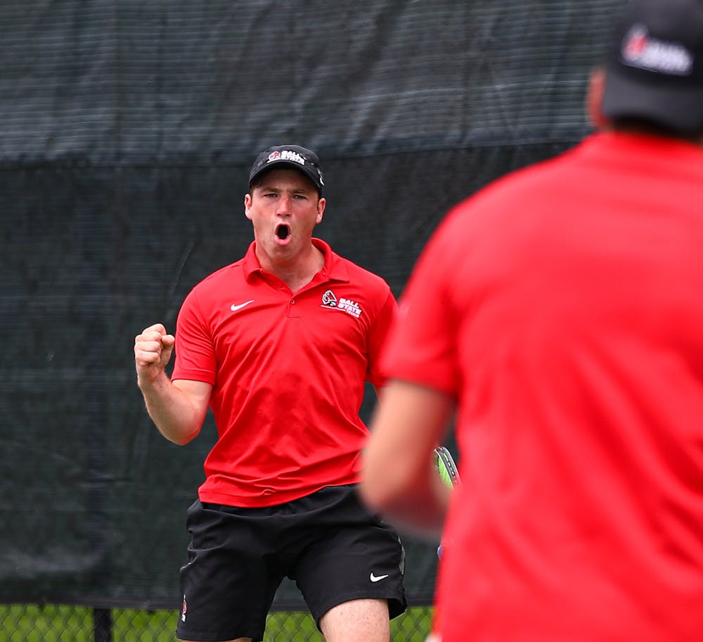 Second-year Nathaniel Webster celebrates a point in a match against Binghamton April 14 at the Cardinal Creek Tennis Center. Ball State shut out the Bearcats 7-0 overall. Jacy Bradley, DN