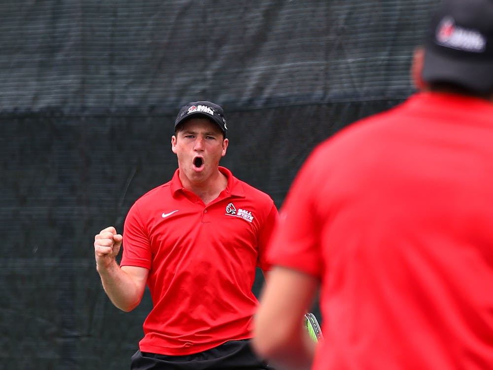 Second-year Nathaniel Webster celebrates a point in a match against Binghamton April 14 at the Cardinal Creek Tennis Center. Ball State shut out the Bearcats 7-0 overall. Jacy Bradley, DN