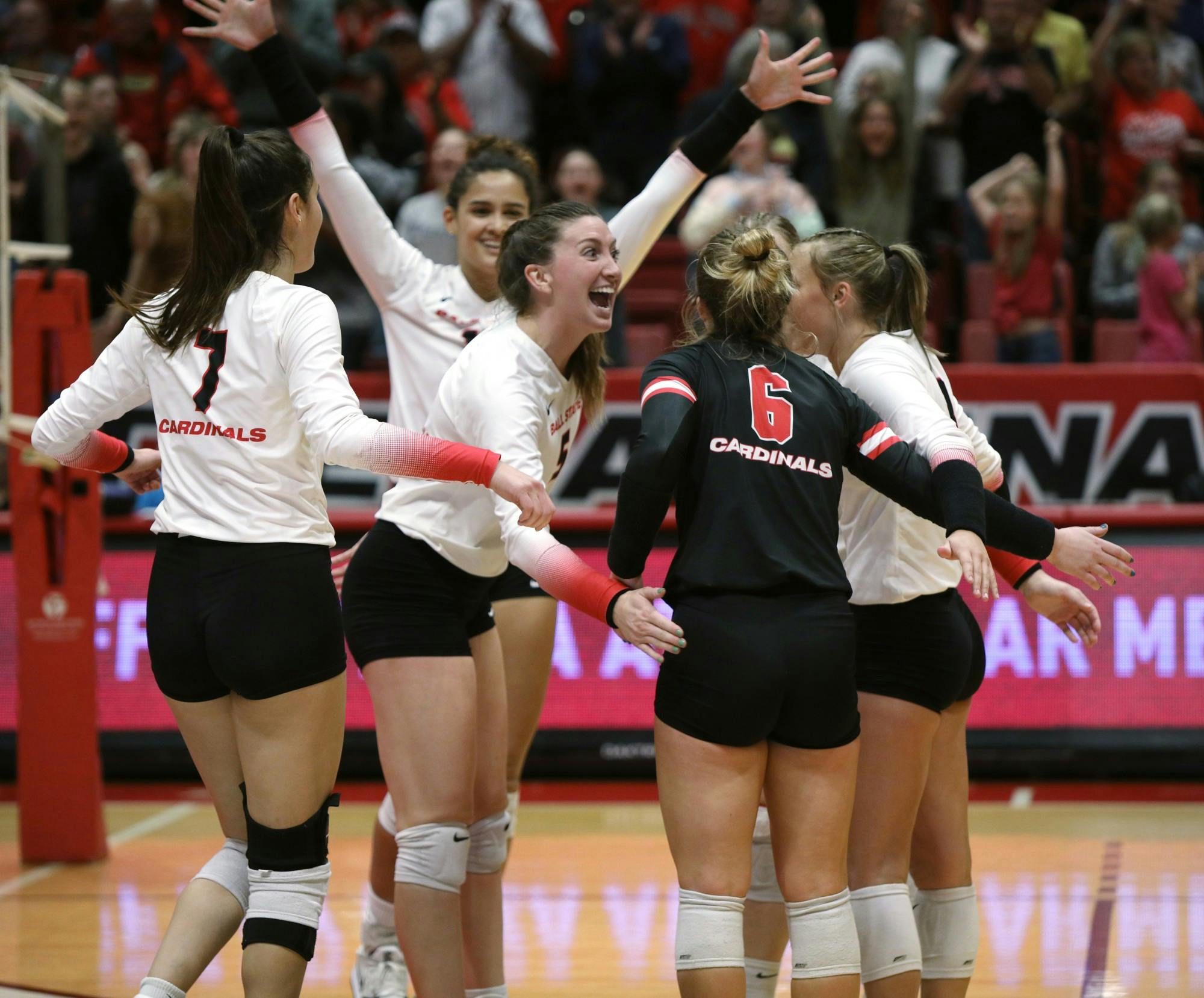The Ball State Women's Volleyball team celebrates scoring a point in a game against Kent State Nov. 4 at Worthen Arena. Ball State swept Kent State to get their 21st win of the season. Amber Pietz, DN
