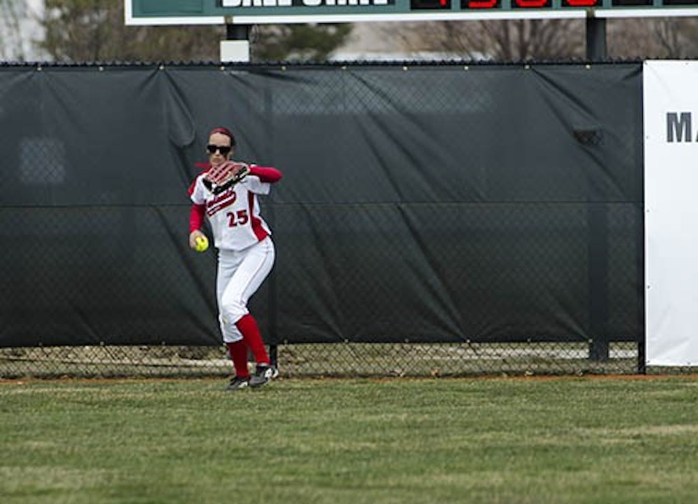 Jennifer Gilbert throws back a ground from Northern Illinois on April 5. Ball State took on the Huskies in their first double header at home. DN PHOTO COREY OHLENKAMP