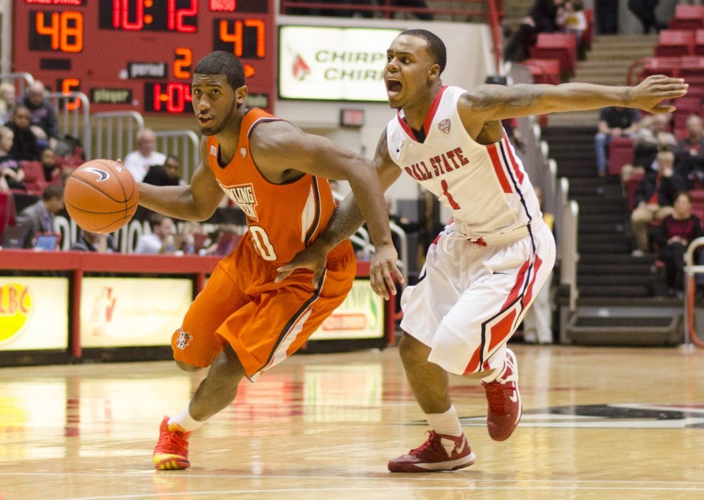 Freshman guard Zavier Turner tries to cover a Bowling Green player Feb. 15 at Worthen Arena. Ball State dropped the game 64-66 against Bowling Green. DN PHOTO BREANNA DAUGHERTY