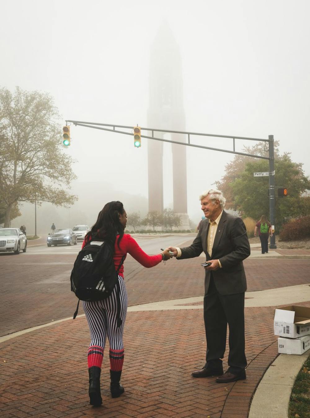 <p>The Gideons passed out Bibles to students all around campus on Oct. 7. The groups goal is to spread knowledge of Christianity and give away free Bibles to people. <em>DN PHOTO KELLEN HAZELIP</em></p>