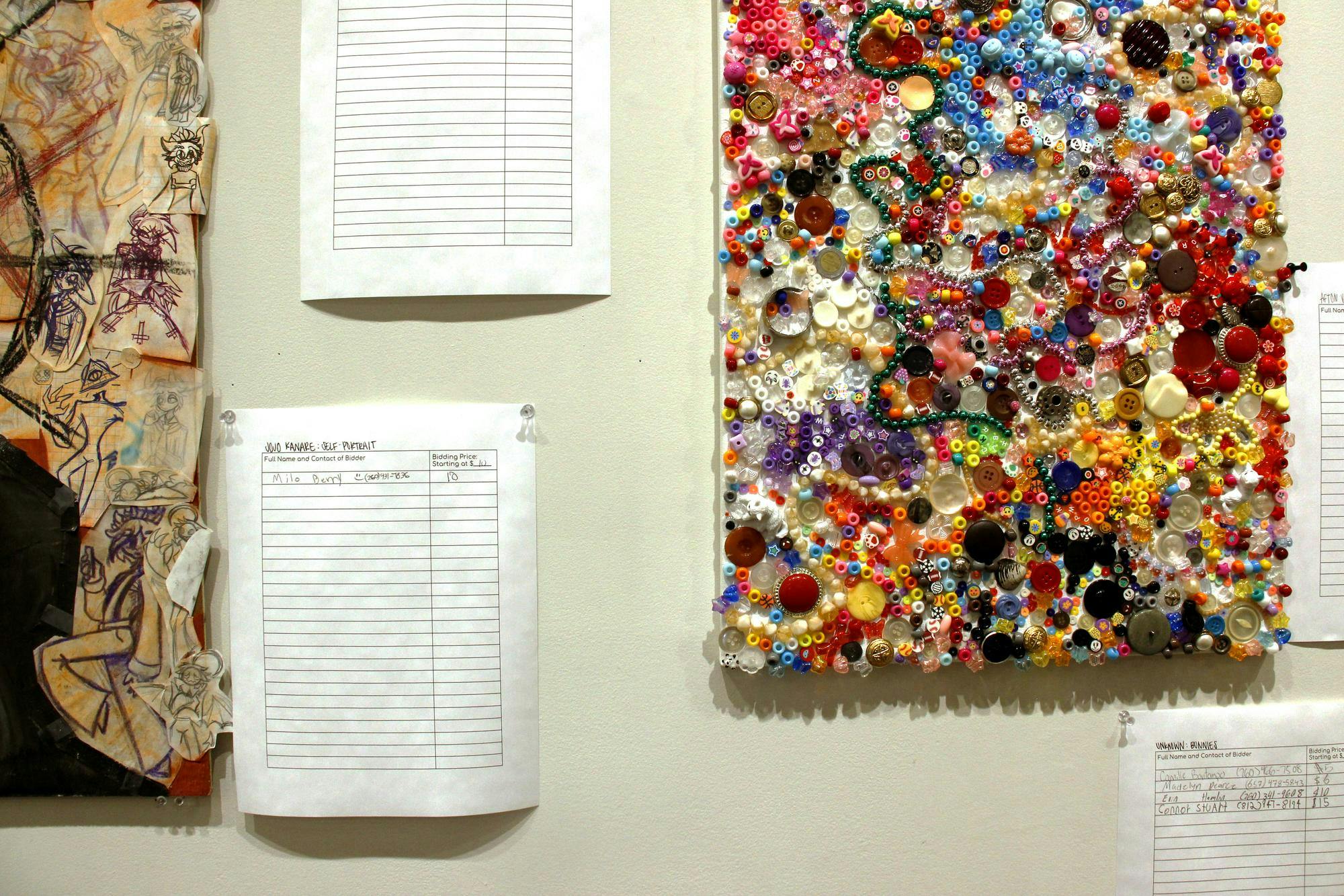 Artwork is displayed during the "Art of Caring" show bidding April 10 in Ball State's Art and Journalism building on Ball State University's campus in Muncie, Ind. Katherine Hill, DN