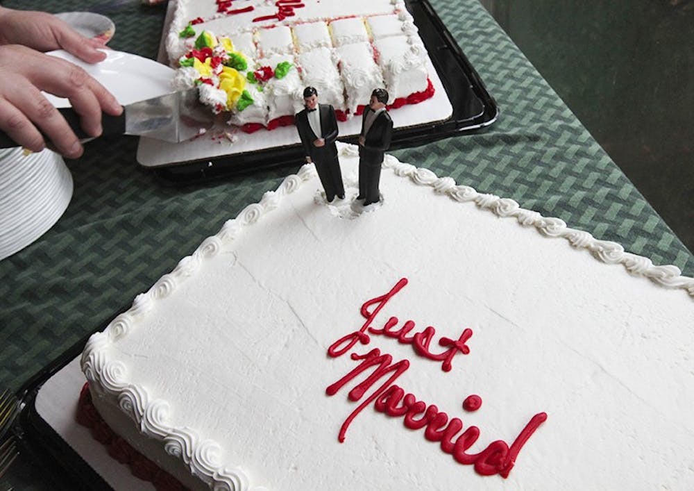 Wedding figures adorn a cake for a same-sex couple, Dec. 9, 2012, in Des Moines. Wash. (Ellen M. Banner/Seattle Times/MCT)