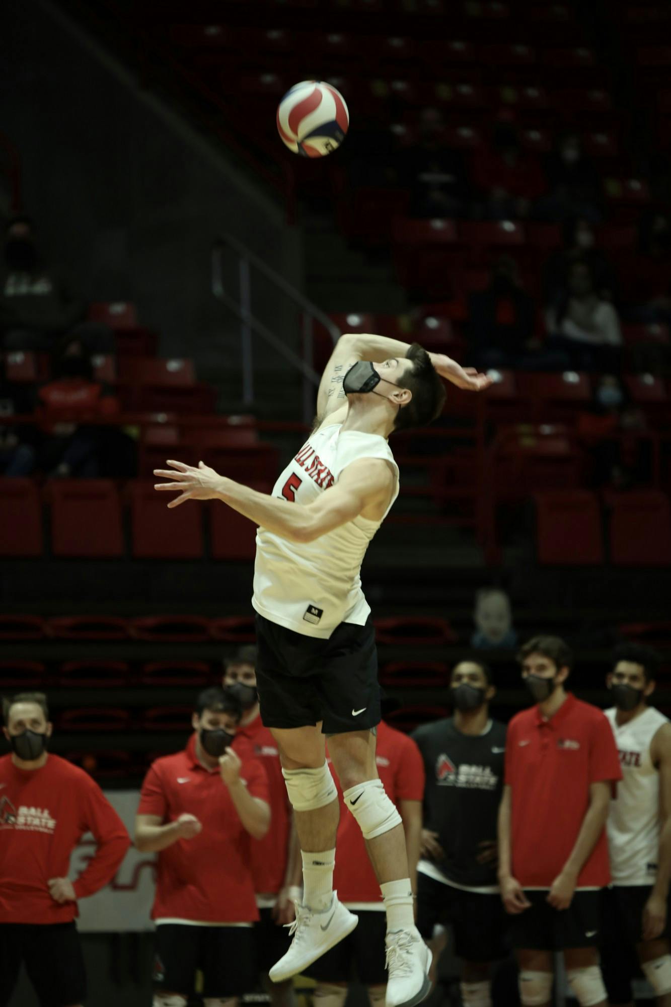 Senior setter Quinn Isaacson serves the ball Feb 27, 2021, in John E. Worthen Arena. The Cardinals lost 3-2 to the Buckeyes. Rylan Capper, DN