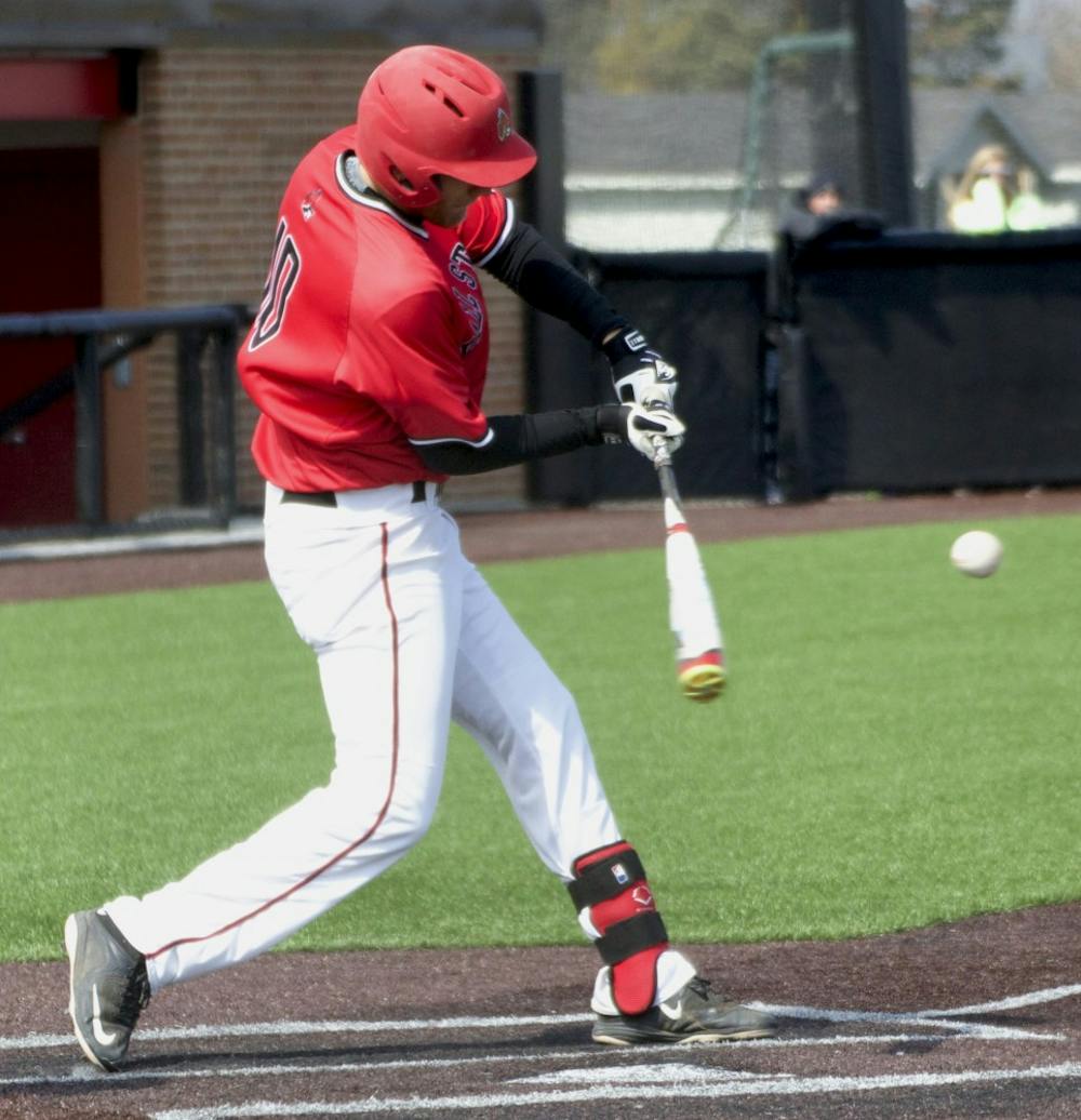 Ball State’s junior infielder Sean Kennedy hits the ball in the game against Dayton on March 19. DN PHOTO GRACE RAMEY
