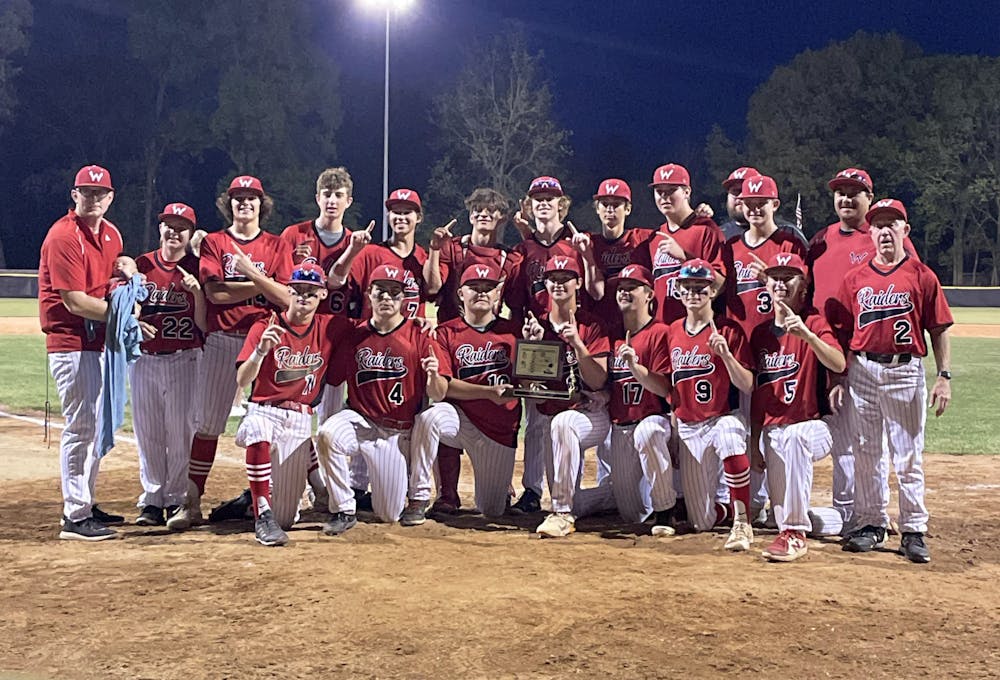 The Wapahani Raiders pose with their trophy May 13 after the Delaware County Championship Game at Yorktown High School. Zach Carter, DN.