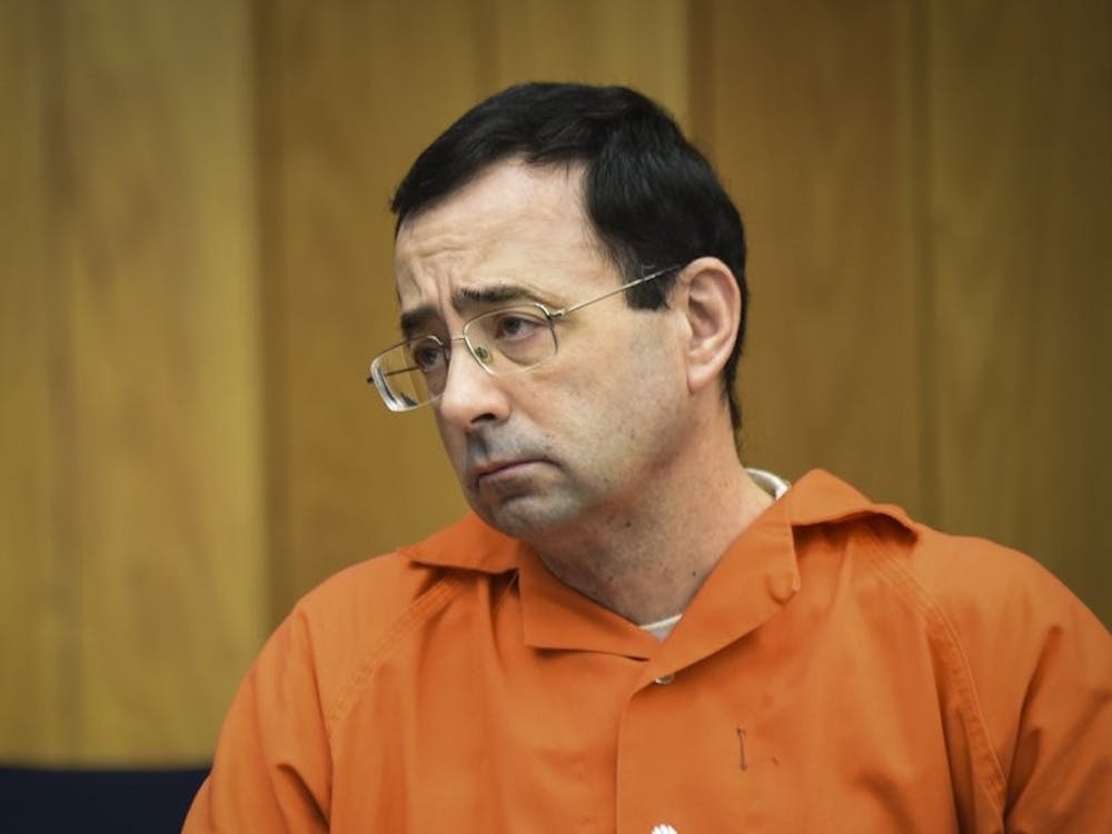 Larry Nassar listens to 17-year-old Jessica Thomashow’s victim impact statement Wednesday, Jan. 31, 2018, during the first day of victim impact statements in Eaton County Circuit Court in Charlotte, Mich., where Nassar is expected to be sentenced on three counts of sexual assault some time next week. Nassar was sentenced to 40 to 175 years in prison in a similar hearing in another county last week. Associated Press, Photo Courtesy&nbsp;