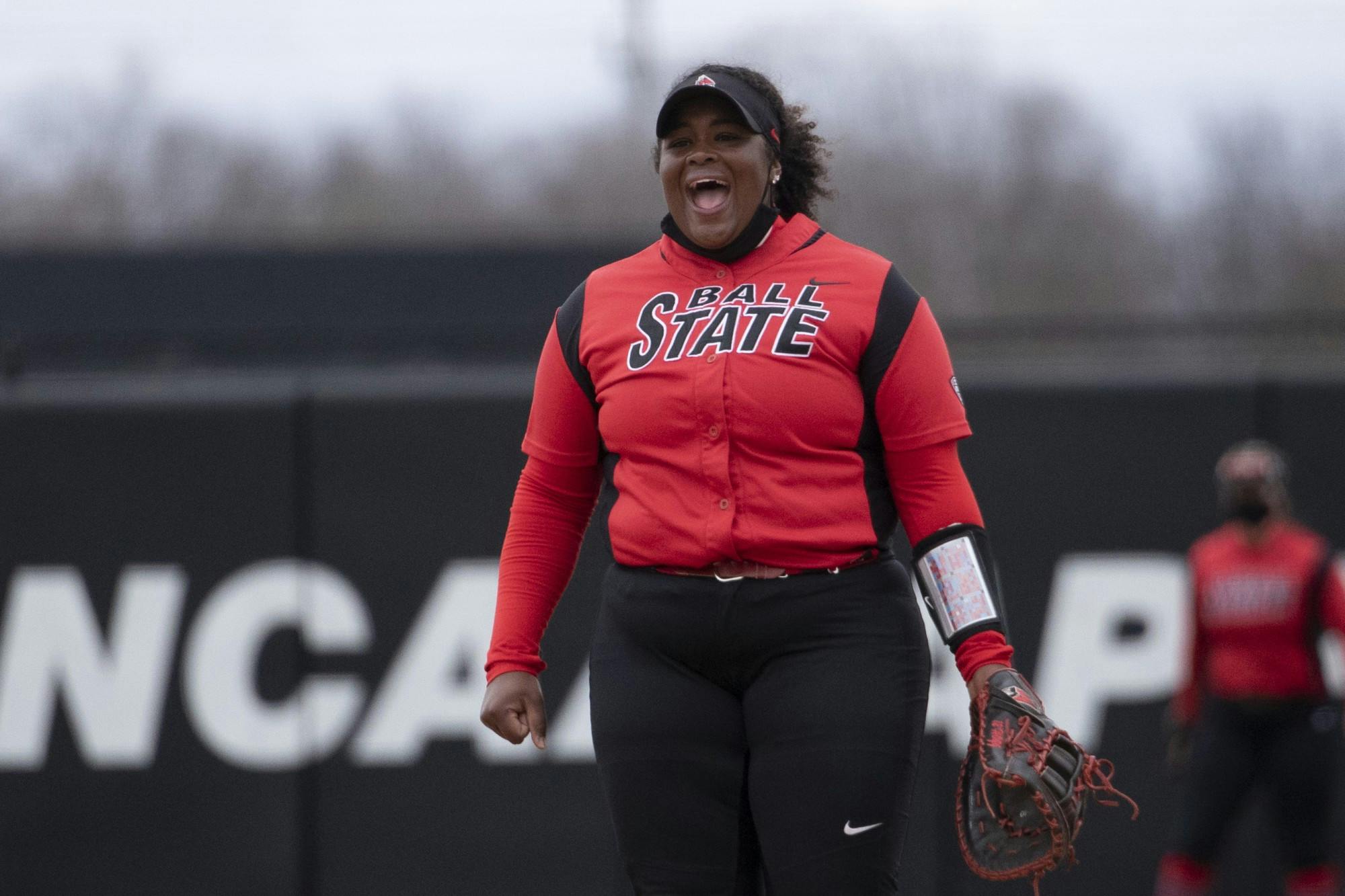 Cardinals graduate first base Janae Hogg yells after a pitch March 28, 2021, at First Merchants Ballpark Complex. The Cardinals beat the Falcons 9-5 and won the series. Jacob Musselman, DN