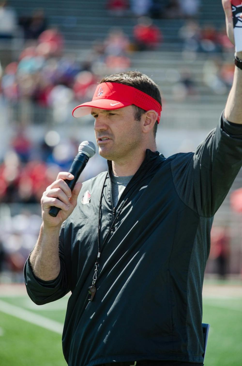 Head Coach Mike Neu introduces the football staff to the audience at the spring game on April 23 at Scheumann Stadium. DN PHOTO KELLEN HAZELIP