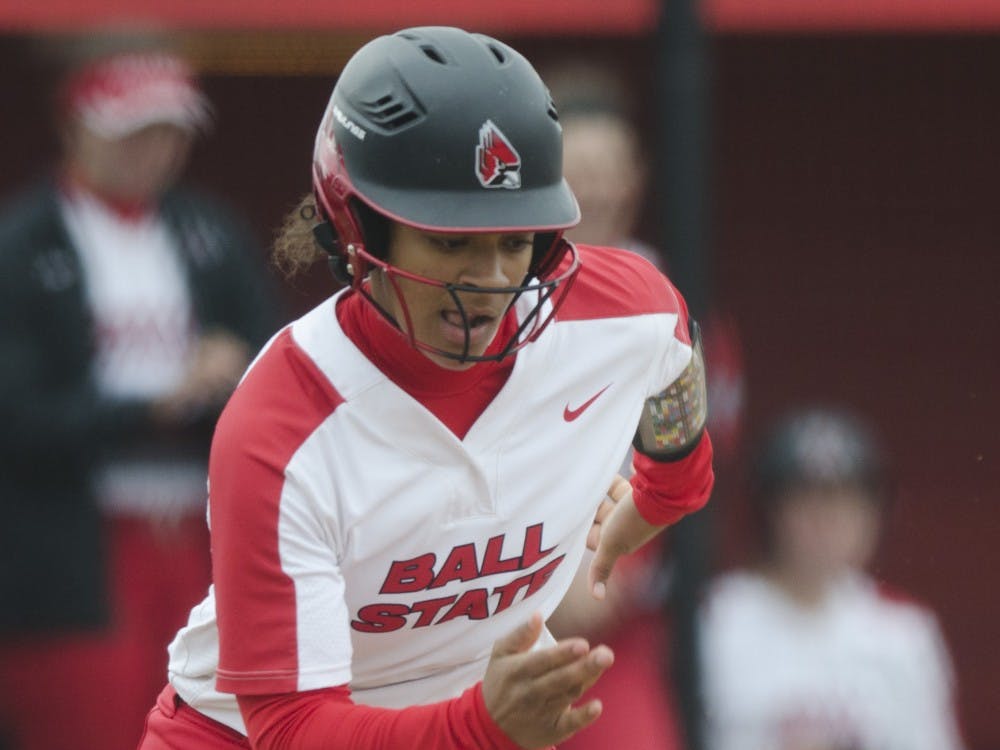 Freshman outfielder Kennedy Wynn runs to first base after a bunt during the second game of the double-header against Northern Illinois on April 4 at the Softball Field at the First Merchants Ballpark Complex. Ball State won 6-4, their sixth consecutive win. Emma Rogers // DN.