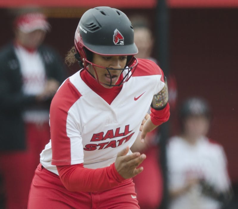 Freshman outfielder Kennedy Wynn runs to first base after a bunt during the second game of the double-header against Northern Illinois on April 4 at the Softball Field at the First Merchants Ballpark Complex. Ball State won 6-4, their sixth consecutive win. Emma Rogers // DN.
