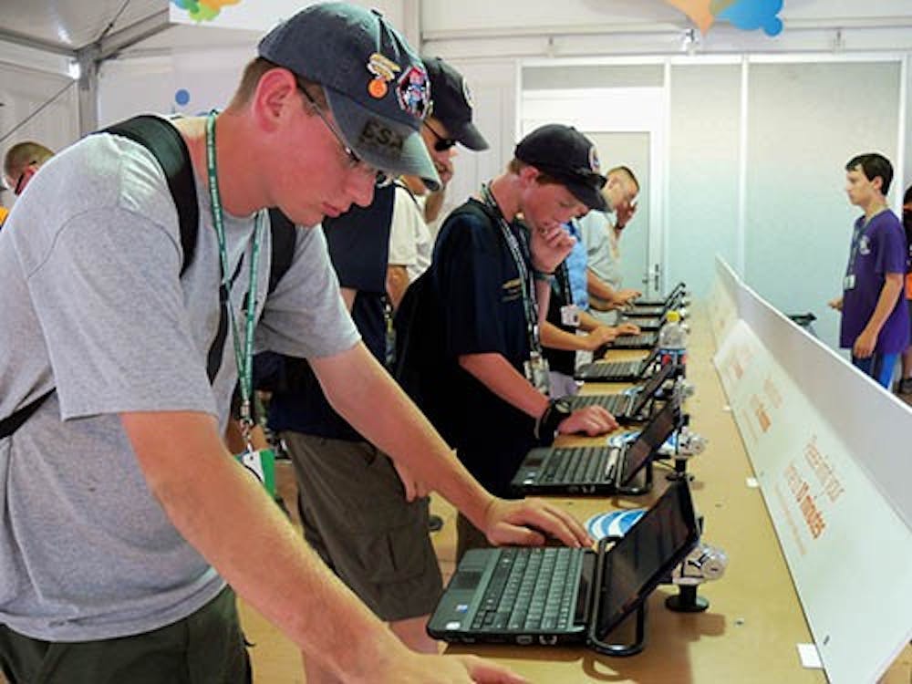 Mike McNicholas of Arlington Heights, Ill., Jamboree Troop 1406, checks Facebook and sends an email home to his parents and sister in July 2012. The Boy Scouts of America are reconsidering their policy on excluding gay members. MCT PHOTO