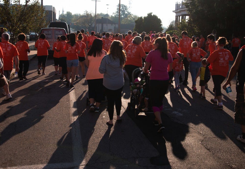 <p>Walkers from all over east central Indiana make their way down Jackson street for the Put Yourself In Her Heels event on Sept. 23 in downtown Muncie. YWCA holds this walk once a year. Grace Hollars, DN</p>