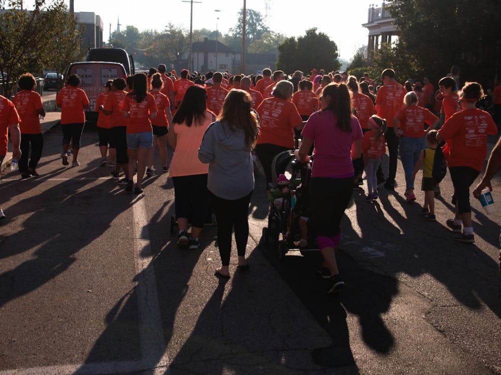 Walkers from all over east central Indiana make their way down Jackson street for the Put Yourself In Her Heels event on Sept. 23 in downtown Muncie. YWCA holds this walk once a year. Grace Hollars, DN