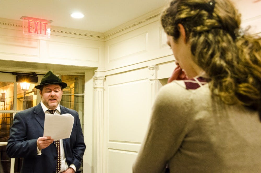 Assistant English professor Brett Blackwell plays Detective inspector Lestrade at the honors murder mystery party. DN PHOTO KELSEY DICKESON