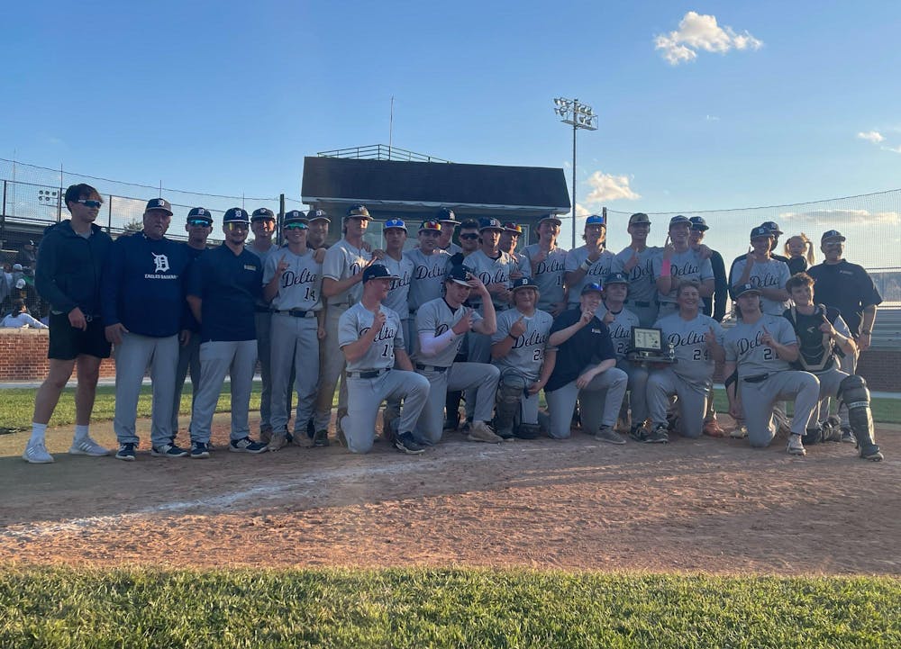 Delta baseball poses with the Delaware County trophy May 11 after winning the Delaware County tournament at Yorktown High School. Zach Carter, DN.