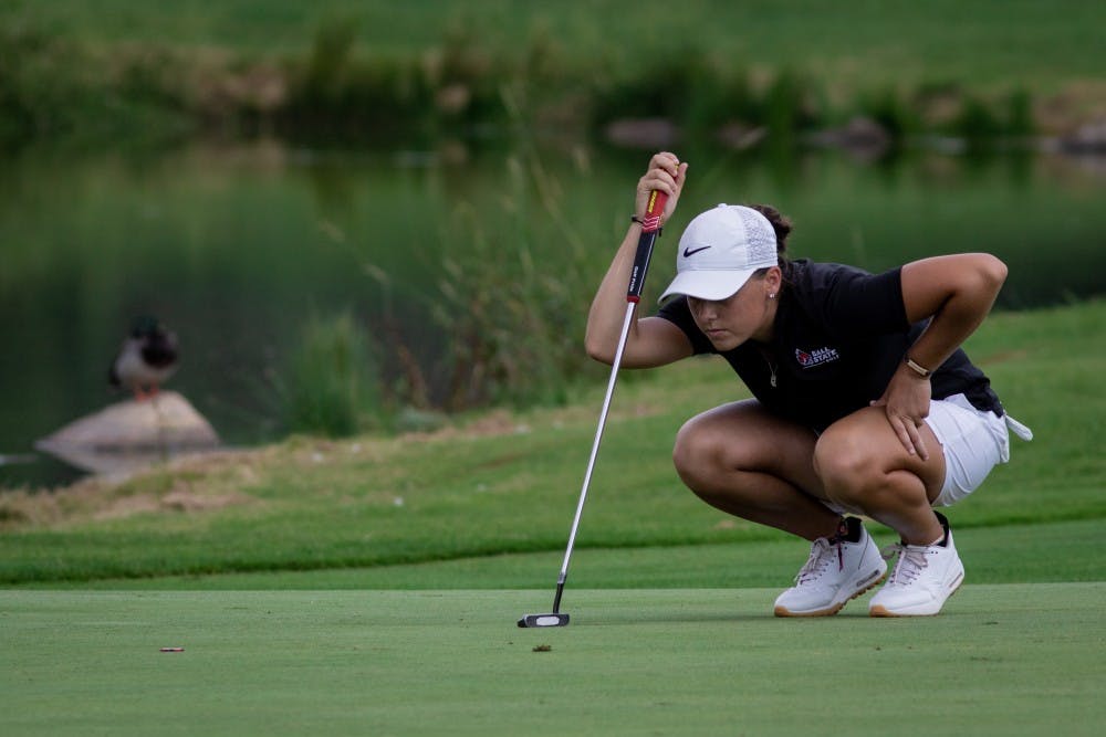 Sophomore Morgan Lewis lines up her put on the green Sept. 16, 2019, at the Players Club at Woodland Trails in Yorktown, Ind. Lewis ended the third round of the Cardinal Classic tournament 4 over par. Eric Pritchett, DN