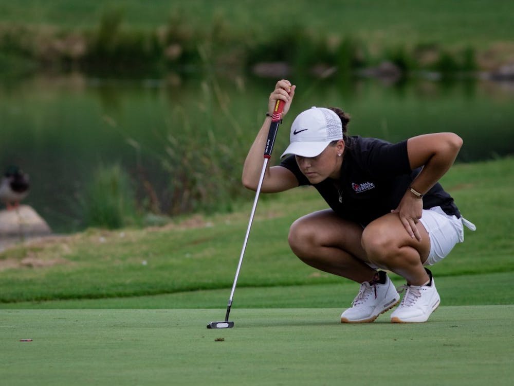 Sophomore Morgan Lewis lines up her put on the green Sept. 16, 2019, at the Players Club at Woodland Trails in Yorktown, Ind. Lewis ended the third round of the Cardinal Classic tournament 4 over par. Eric Pritchett, DN