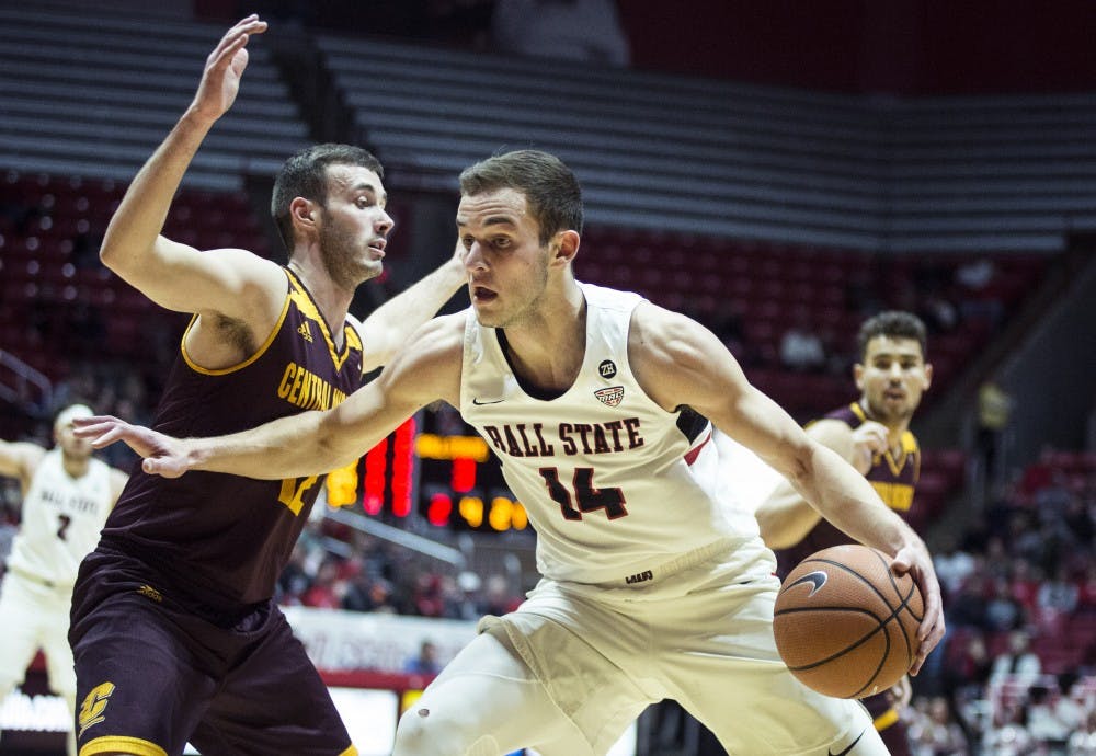 <p>Sophomore forward Kyle Mallers pushes down the court against a Central Michigan guard, Jan. 16 at John E. Worthen Arena. Ball State defeated Central Michigan, 76-82. <strong>Grace Hollars, DN</strong></p>