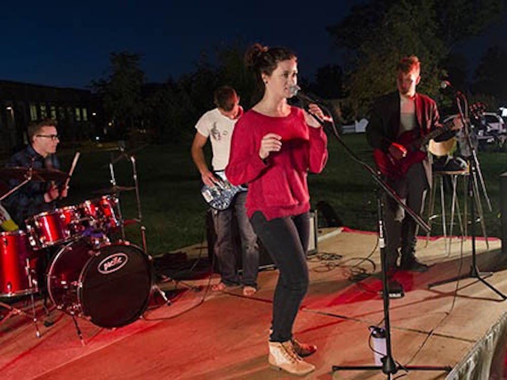 The Red Jessup and the Woofs perform a show at the Homecoming Village on Oct. 7.  A rock climb, zip line, photo booth and mechanic bull were also offered at the Homecoming Village. DN PHOTO BREANNA DAUGHERTY 