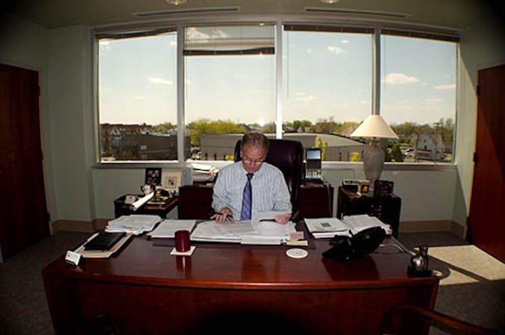 Mayor Dennis Tyler looks over paper work in his office during his first year as mayor. Tyler started a program that encourages citizens to come into his office and speak with him about whatever issues they want. DN FILE PHOTO BOBBY ELLIS