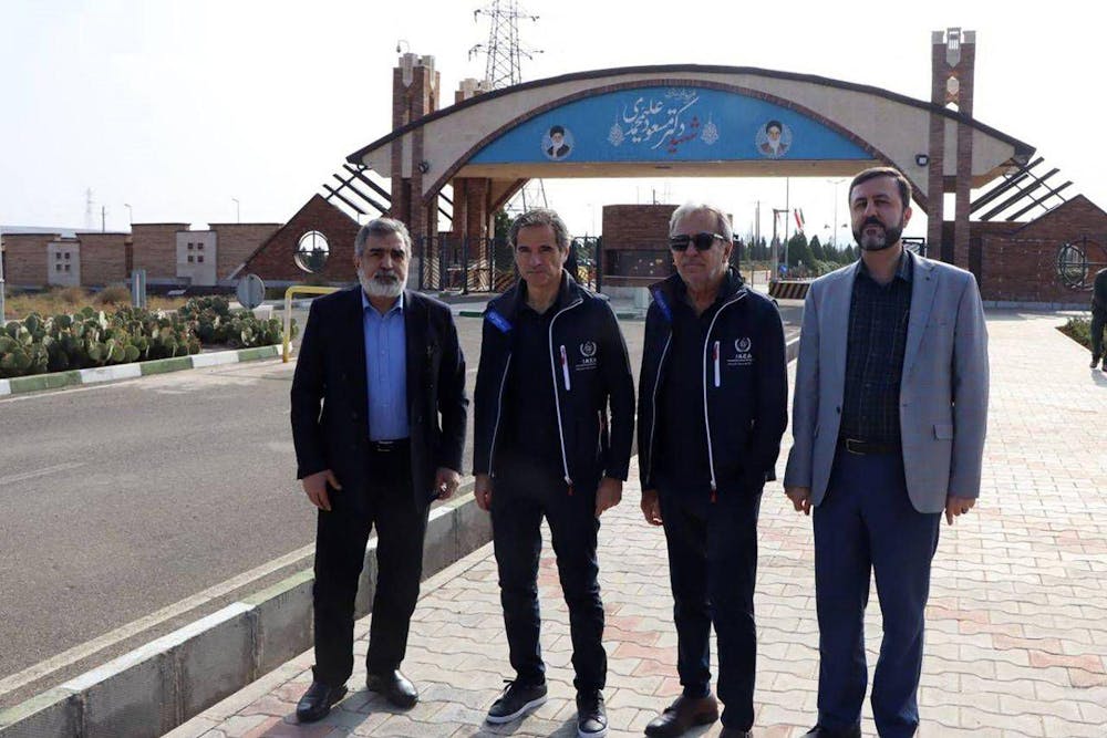 <p>This handout picture provided by the Atomic Energy Organisation of Iran on November 15 2024 shows the organisation's spokesman Behrouz Kamalvandi (L) and Iran's Deputy Foreign Minister Kazem Gharib Abadi (R), posing for a picture with the International Atomic Energy Agency (IAEA) chief Rafael Grossi (2nd-L), in front of the gate of the Fordow nuclear enrichment plant, in Fordow near the city of Qom. Grossi on November 15 toured two Iranian uranium enrichment plants that have been the focus of Western concern, after Tehran said it was ready to address "doubts" about its ambitions.(Photo by -/Atomic Energy Organization of Iran/AFP via Getty Images, TNS)</p>