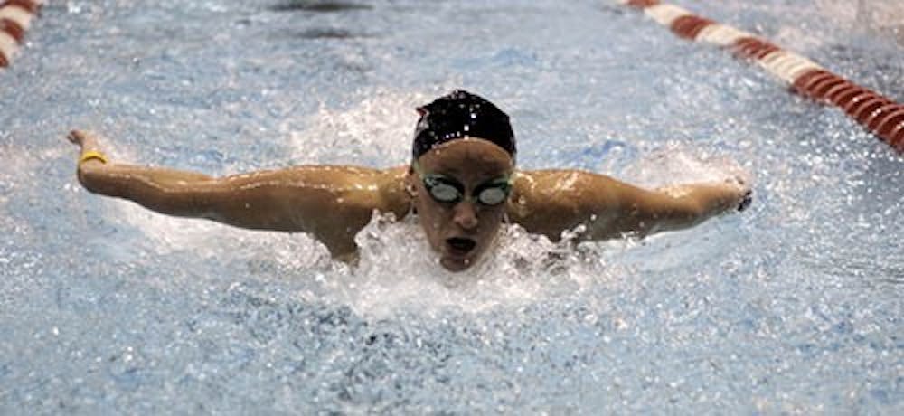 Mallory Miles starts her last lap in the 100 yard Bufferfly competition during Monday's swim meet against Illinois State. Mallory took second with a time of 58.40.DN PHOTO RJ RICKER