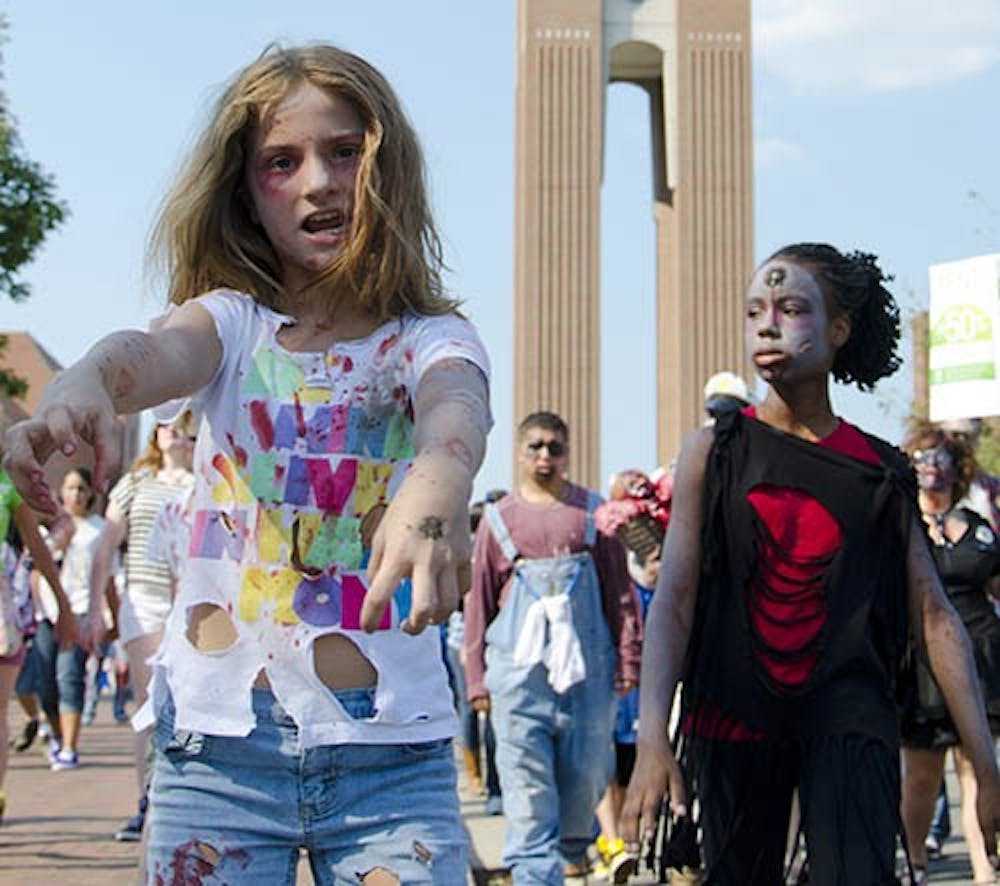 Willoe Cunnington walks with roughly 250 other zombies in a benefit walk for charity on August 25, 2012. This years walk will be held on Sept. 13. DN FILE PHOTO COREY OHLENKAMP