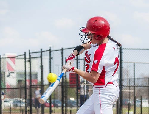 Senior Amanda Carpenter connects with the Butler pitch during their game on April 9, 2013. The softball team played Indiana University and won with a final score of 5-2. DN PHOTO JONATHAN MIKSANEK