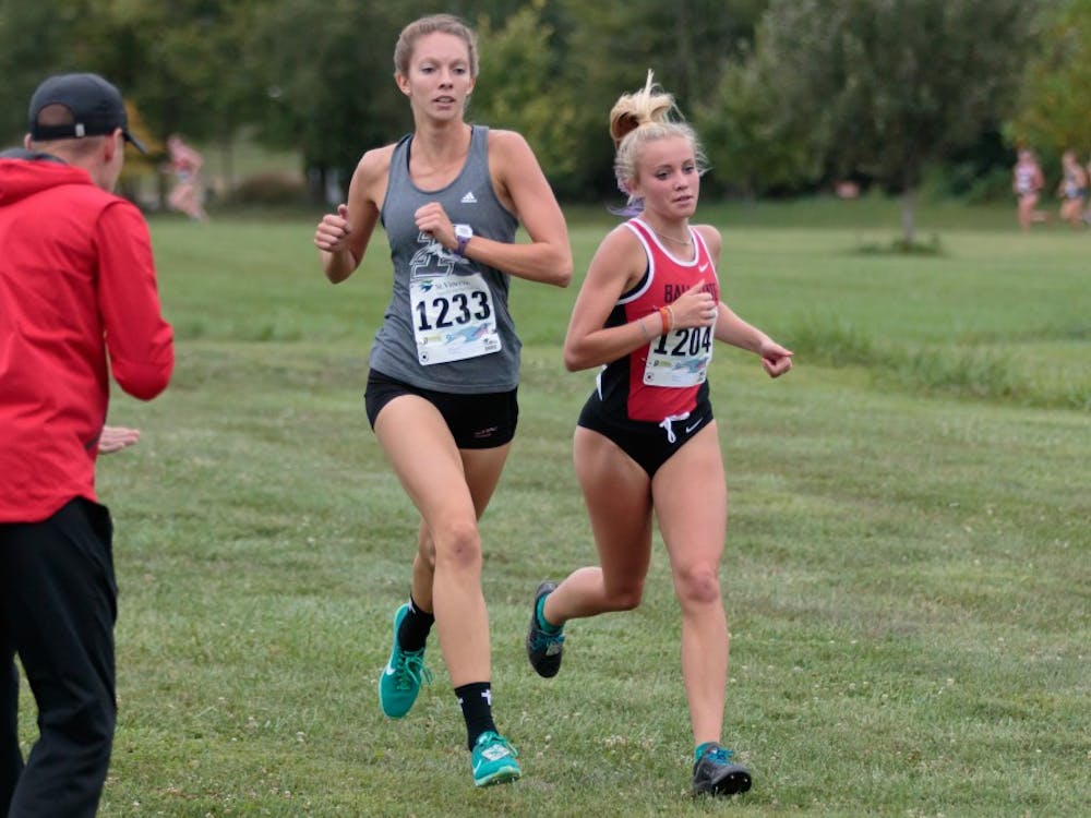 Runner Cayla Eckenroth fights for the lead during the Butler Twilight meet at Northview Church on Sept. 1, in Carmel, IN. Eckenroth finished second in the 5K with a time of 18:27.3. Kyle Crawford, DN File