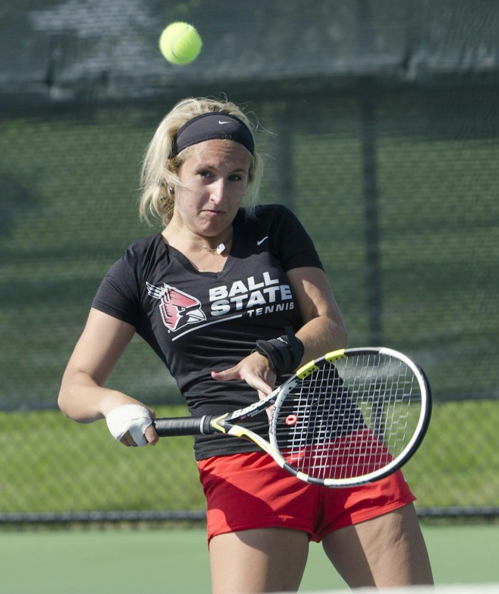 Senior Courtney Wild returns the ball during the doubles match against Butler for the Fall Dual on Sept. 20 at the Cardinal Creek Tennis Center. DN PHOTO BREANNA DAUGHERTY 