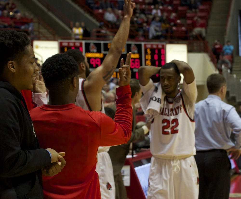 The Ball State men’s basketball team cheers from the sidelines as one of its teammates scores a basket in the game against Eastern Michigan on Feb. 27 in Worthen Arena. The Cardinals beat their record of highest number of points since 1989, scoring 115 to 79. DN PHOTO GRACE RAMEY