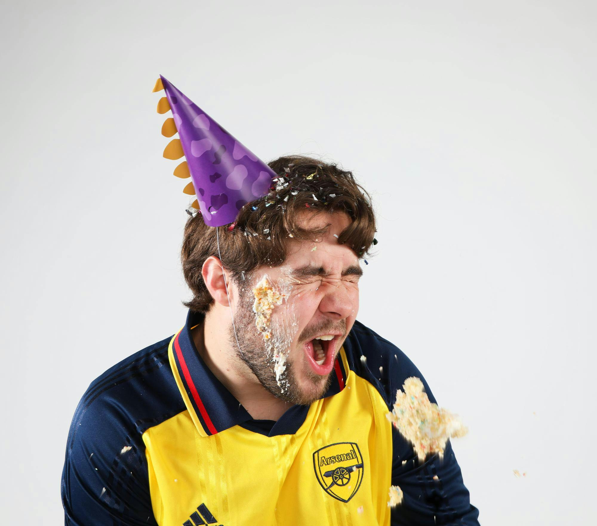 Third-year journalism and media major Daniel Kehn reacts after getting cake thrown at his face Nov. 6 at the Art and Journalism Building. Mya Cataline, DN
