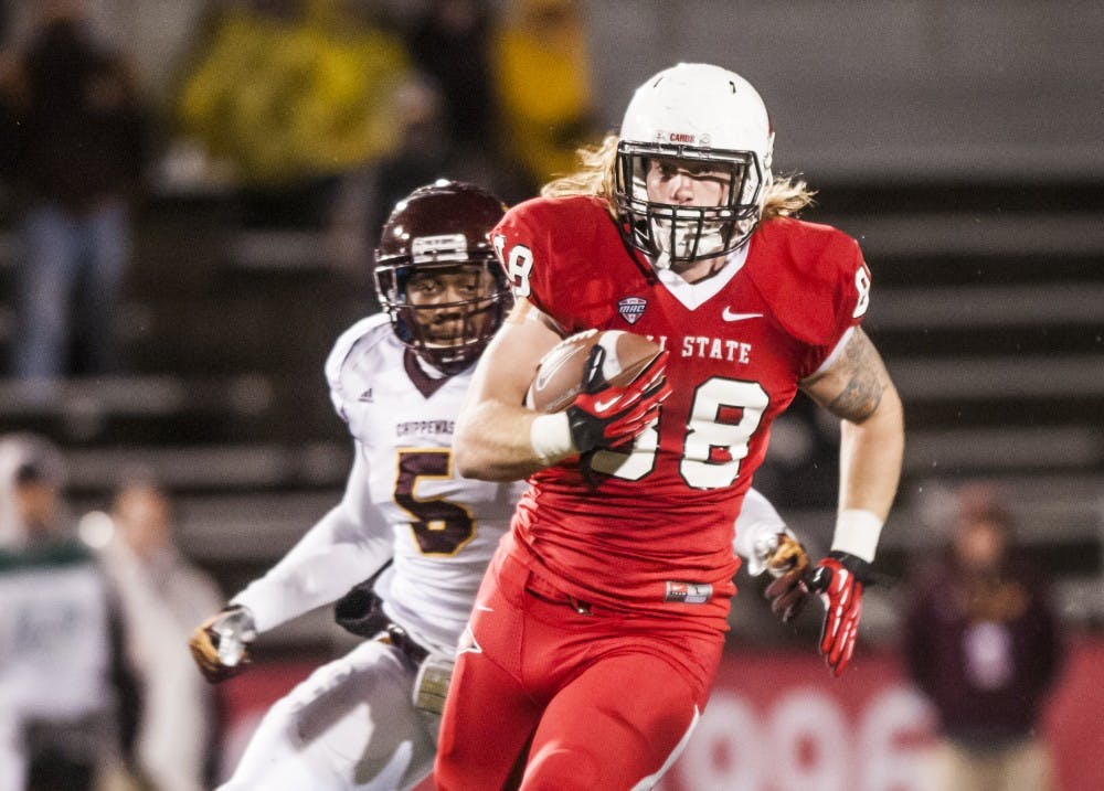 Senior tight end Zane Fakes makes a push down the field against Central Michigan University on Nov. 6. DN PHOTO JONATHAN MIKSANEK