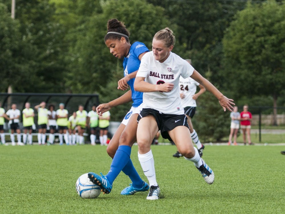 Sophomore defender Leah Mattingly tries to steal the ball away from an IPFW player on Aug. 22 at the Briner Sports Complex. DN PHOTO JONATHAN MIKSANEK