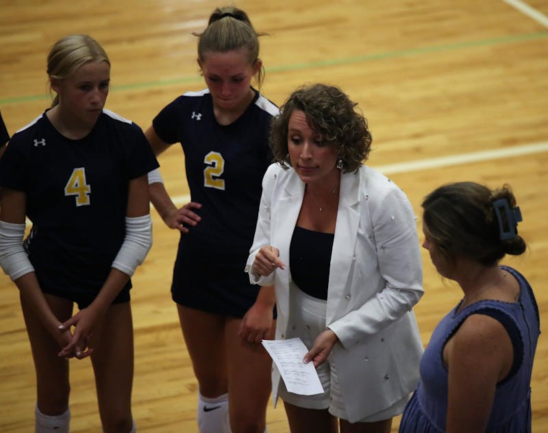 Delta head coach Kylie Johnson talks Aug. 21 during a timeout against Wapahani at Delta High School. Delta fell after five sets. Zach Carter, DN.