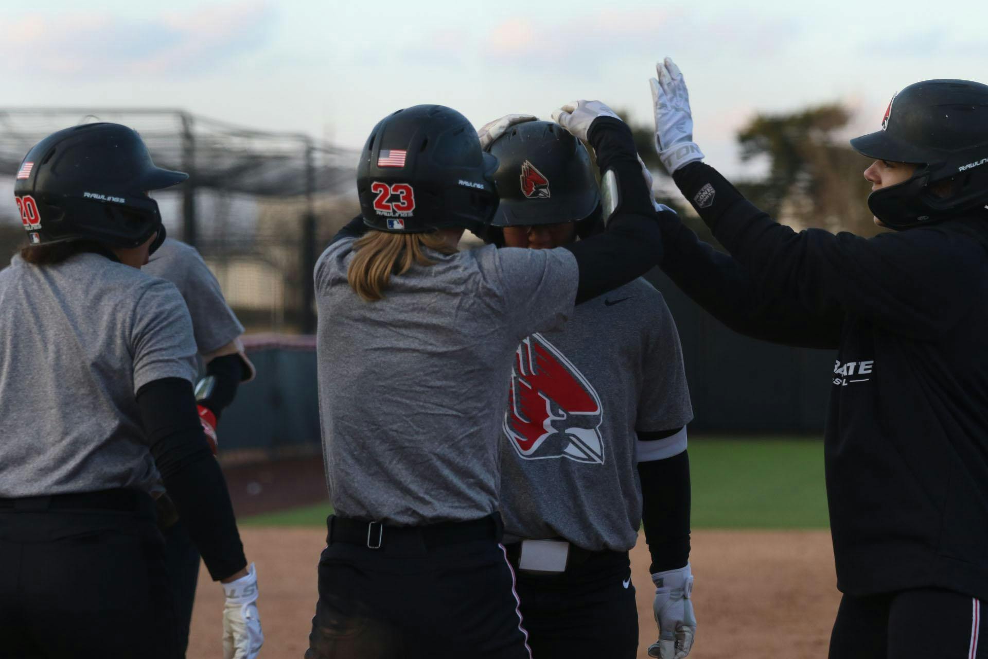 Graduate student Samantha-jo Mata is celebrated by teammates after hitting a home run Feb. 13 during a practice at the softball field at the First Merchants Ballpark Complex. Zach Carter, DN.