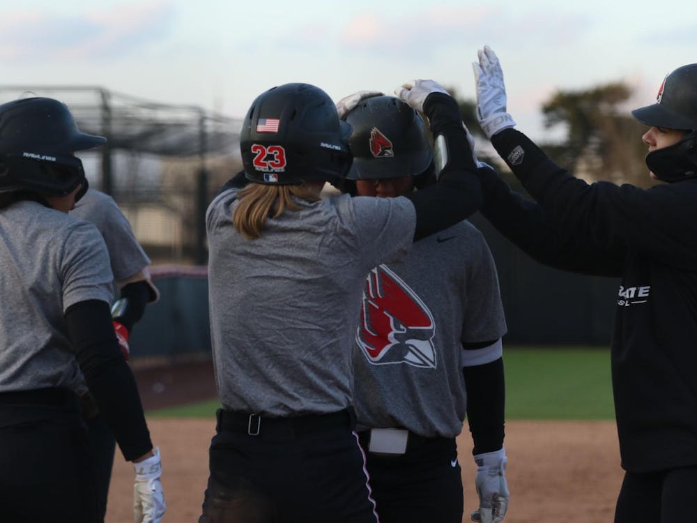 Graduate student Samantha-jo Mata is celebrated by teammates after hitting a home run Feb. 13 during a practice at the softball field at the First Merchants Ballpark Complex. Zach Carter, DN.