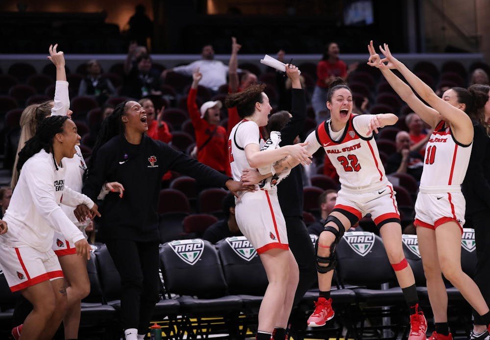 <p>Ball State women's basketball celebrates junior Alex Richard scoring a three-point basket against Ohio March 13 at Rocket Mortgage FieldHouse in Cleveland, Ohio. This was Richard's first three-point basket for Ball State. Mya Cataline, DN</p>