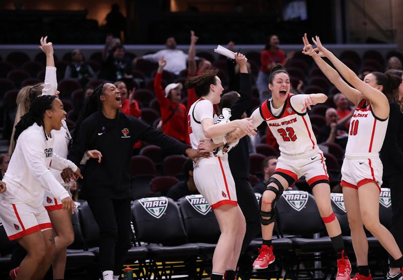 Ball State women's basketball celebrates junior Alex Richard scoring a three-point basket against Ohio March 13 at Rocket Mortgage FieldHouse in Cleveland, Ohio. This was Richard's first three-point basket for Ball State. Mya Cataline, DN