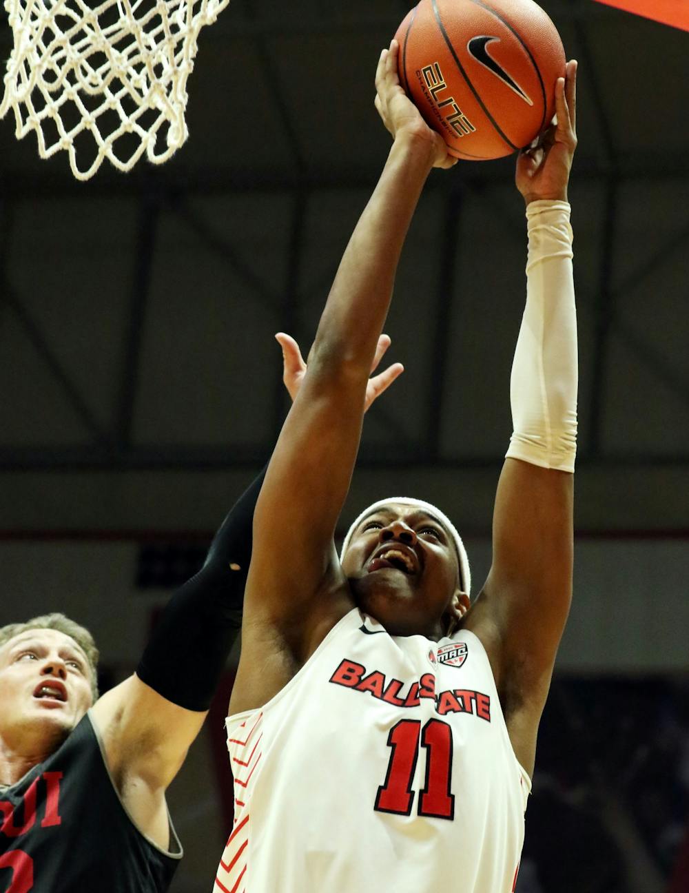 <p>Ball State redshirt freshman guard Jarron Coleman shoots a layup while being guarded by IUPUI junior guard Grant Weatherford during the Cardinals' game against the Jaguars Dec. 7, 2019, at John E. Worthen Arena, Coleman was the Cardinals leading scorer with 20 points. <strong>Paige Grider, DN&nbsp;</strong></p>