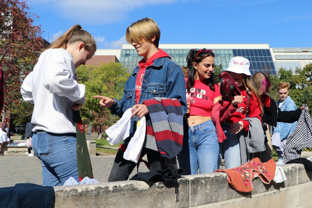 <p>Students shop for clothes at the Green Theatre Society’s annual clothing swap Oct. 23 at University Green. The club hosts the clothing swap to encourage students to have more sustainable shopping methods and to spread its message. <strong>Maya Wilkins, DN</strong></p><p></p>
