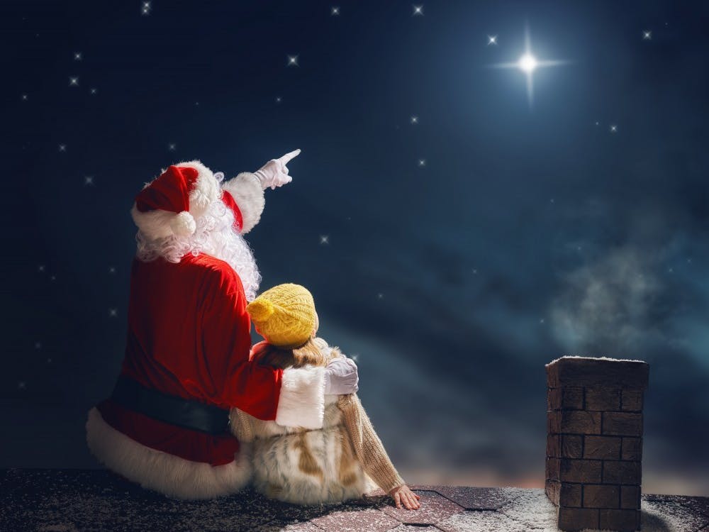 Santa Claus and Noël sit on a rooftop stargazing during Noël the musical. Noël was written by Eoin Colfer and composed by Liam Bates in 2016. Jean Clancy, Photo provided. 